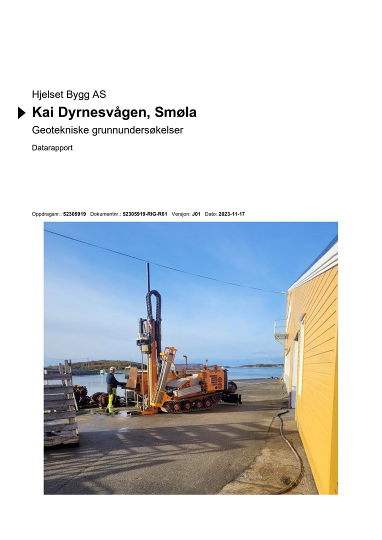 Fotografi av en boremaskin ved siden av en gul bygning, som illustrerer geotekniske grunnundersøkelser.