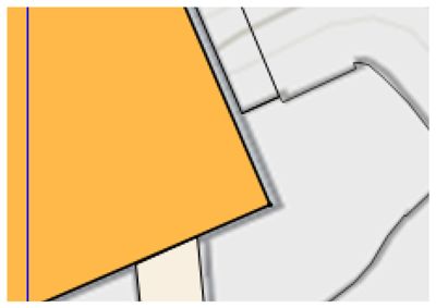 Et kartutsnitt som viser en bygning (gult) i forhold til eiendomsgrenser og nabolag.