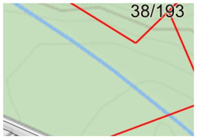 Et kartutsnitt som viser et grønt område med en blå linje (sannsynligvis vann eller vei) og røde grenselinjer, samt teksten '38/193' i øvre høyre hjørne.