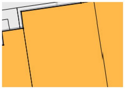 Et utdrag fra en etasjeplan eller romfordeling, der gulrom er farget oransje og hvite områder antyder andre rom eller vegger.