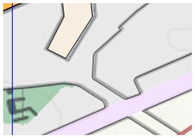 Et digitalt kart eller situasjonsplan som viser en del av et område med bygninger, veier og grøntområder.