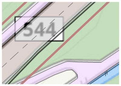 Kartutsnitt som viser en del av et areal med fargekodet informasjon (grønt for vegetasjon, rosa for vei eller infrastruktur) og en markering med nummeret '544'.