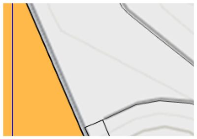 Et detaljutsnitt fra en situasjonsplan som viser tommeform, grenser (grå linjer) og et område markert med farge.