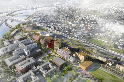 3D-visualisering av et planlagt byutviklingsprosjekt med flere nye bygninger, infrastruktur og omgivende landskap.