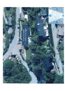 Flyfoto eller satellittbilde av et boligområde med overlagte tegninger og tekster som viser planlagt utbygging.