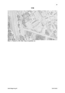 Et gammelt flyfoto fra 1948 som viser et område med jernbanespor, veier og bygninger.