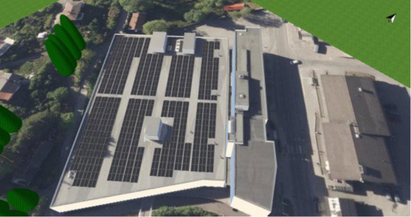 3D-visualisering av et bygg sett fra luften, med solcellepaneler på taket og omgivende bebyggelse.