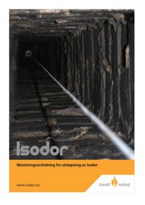 Fotografi av en utstøpning (sandsprøyte) inne i en isolasjonsskjell, sannsynligvis fra en teknisk manual eller veiledning.