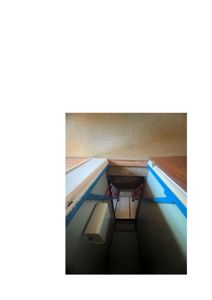 Fotografi av en trapp og et trapphus sett fra et overliggende nivå nedover.