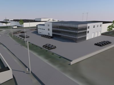 3D-visualisering av en industriell eller kontorbygning med omgivende parkeringsplasser, veier og naboarealer.
