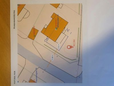 Situasjonsplan som viser tomtens grenser, nabobebyggelse, veier (Nansensgate, Idrettsgate) og mål på eiendommen.