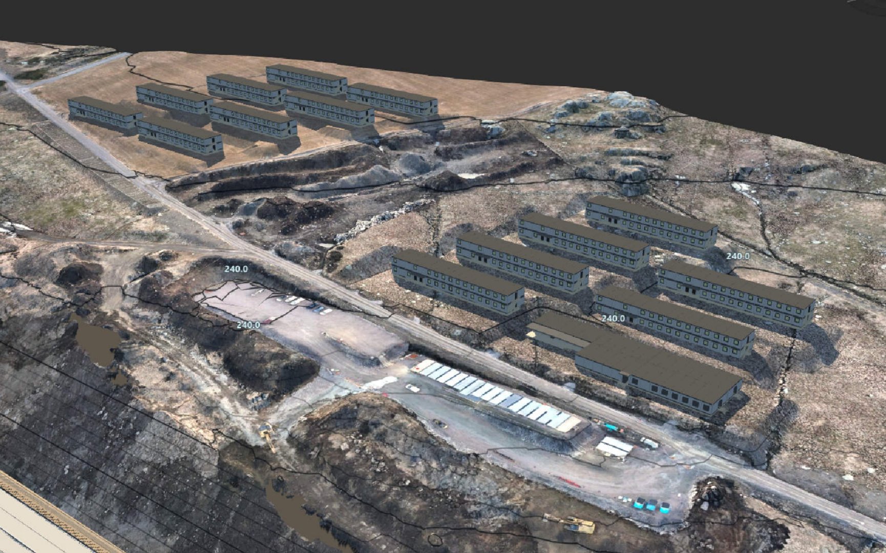 Fotografi av et eksisterende eller planlagt anlegg med flere bygninger, sett fra luften (flyfoto eller dronefoto).