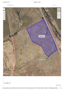 Gårdsplan eller situasjonskart fra NIBIO som viser eiendomsareal (38093 m²) med overlagte kartlag, inkludert vindmølle og vei.