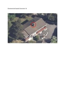 Fotografi av eksisterende fasade og tak for Granveien 19, med en markering (rød sirkel) på et element på taket.