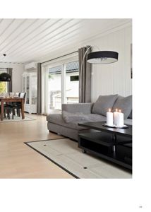 Fotografi av et innredet stue- og spisestueområde i en bolig.