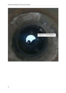 Fotografi av utsiden av et fordelingsskum (utløpsrør) i et avløpsrenseanlegg.