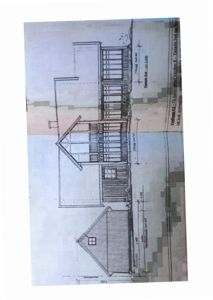 Fasadetegning som viser bygningens utseende sett fra sør (Sør-fasade). Tegningen inkluderer detaljer om vinduer, takform, veggkonstruksjon og høydemål.