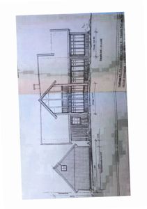 Fasadetegning som viser bygningens utseende sett fra sydvest, inkludert vinduer, takform og fasadematerialer.