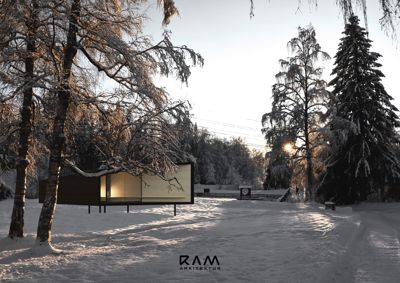 Fotografi av en moderne bygning i en snødekt skog.