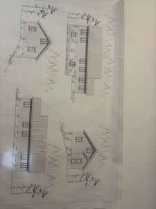 Fasadetegning som viser fire utsnitt av en bygning sett fra ulike vinkler (for-, bak-, side- og frontside).