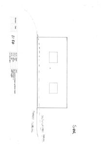 Fasadetegning (opprikk) av en bygning sett fra sør, med angitte terrengforhold og vindusåpninger.