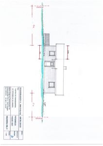 Fasadetegning av en bygning sett fra vest, med mål og detaljer.