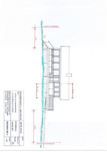 Fasadetegning av en bygning med oppriss, mål og håndskrevne merknader.