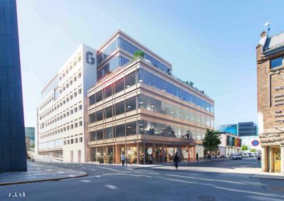 3D-visualisering av en planlagt bygning i et bymiljø, med detaljer om fasade, vinduer og omgivende gater.