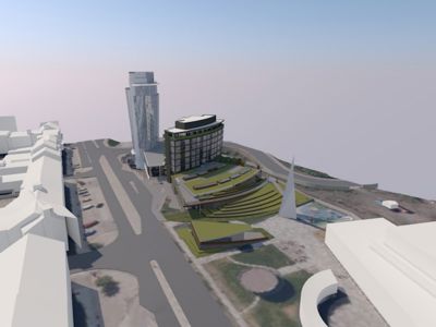 3D-visualisering av et nytt byggprosjekt sett fra luften, inkludert omgivelsene og infrastruktur.