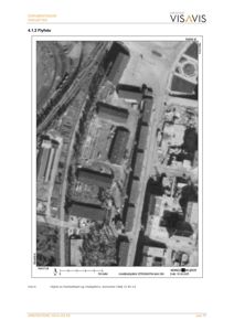 Et flyfoto (luftfotografi) av et industriområde med flere bygninger, jernbanespor og veier.