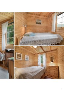 Fotografi av et innvendig soverom i en hytte med trepanelvegger, senger og møbler.