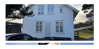 Fotografi av en hvit, toetasjes bygning sett fra siden, med bil og hage i forgrunnen.