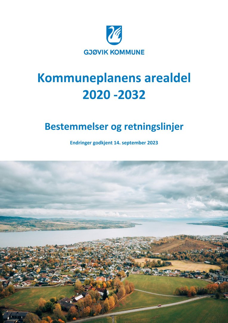 Et luftfoto (aerial view) av Gjøvik kommune, som viser byens beliggenhet ved vannet og omgivelsene.