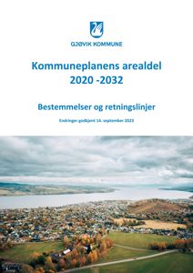 Et luftfoto (aerial view) av Gjøvik kommune, som viser byens beliggenhet ved vannet og omgivelsene.