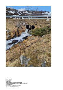 Fotografi av en kulvert med vann som renner ut i et landskap.