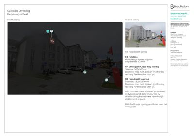 Fotografi av en bygning med skilt og pyloner, illustrerende en utendørs belysningseffekt.