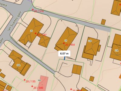 Situasjonsplan som viser tomtene, bygningers plassering og høydemål (f.eks. 6.07 m) i et område med gater som 'tan Svartes gate'.