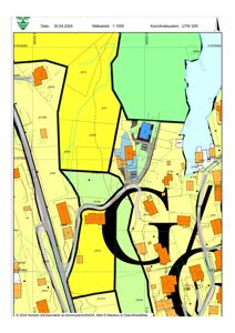 Kart over et område med bygningsplasseringer, vegnett og arealbruk (fargekodet).