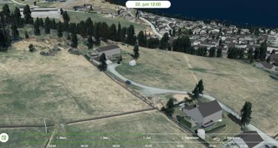 Fotografi av et eksisterende eller planlagt område sett fra luften, sannsynligvis tatt med en drone. Bildet viser terreng, beplantning og flere hus.