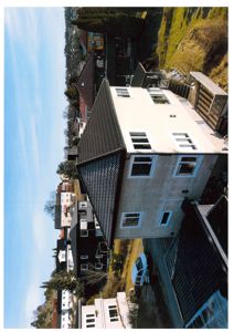 Fotografi av en eksisterende eller ferdigstilt bolig sett fra lufta eller en høy vinkel.