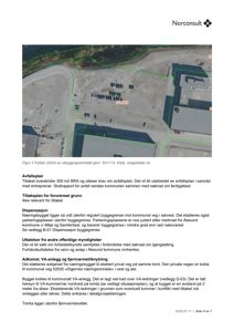 Flyfoto av et utbyggingsområde med parkeringsplasser og bygninger.