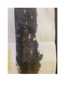 Fotografi av eksisterende hus og terreng i et kystnært område.