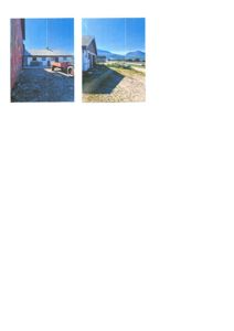 Fotografi av en bygning sett fra utsiden, med en traktor i forgrunnen og fjell i bakgrunnen.