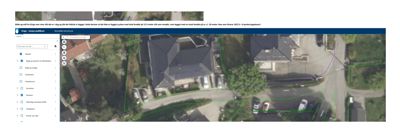 Luftfoto av en tomt med en eksisterende bolig, bilplasser og omgivende bebyggelse. Bildet inneholder også digitale markeringer (grønne linjer) som definerer tomtegrenser.