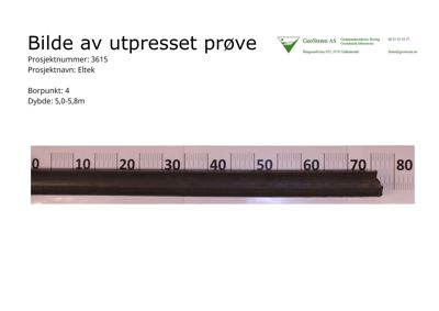 Fotografi av en utpresset jordprøve med målestokk