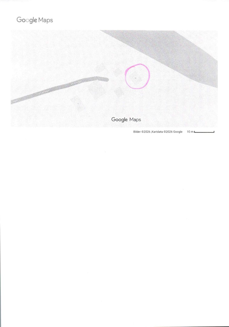 Et utskrift fra Google Maps som viser en del av et kart med en markert tomt (rosa sirkel) og en vei.