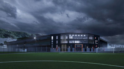3D-visualisering av en moderne idrettshall eller klubbhus sett fra en fotballbane under en dramatisk himmel.