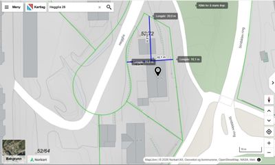 Kartutsnitt fra Norkart som viser Heggila 26 med overlagte grønnfargede arealer (sannsynligvis byggeområder eller tomtegrenser) og målelinjer.