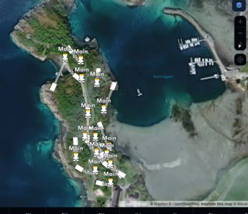 Satellittkart over et kystområde med en havn (Vallvågen) og flere markerte punkter med tekster som 'Main', '5L', '4LL' osv.
